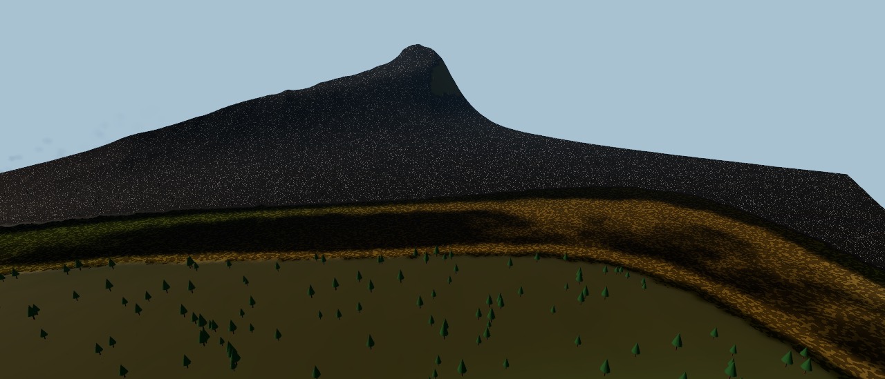 A blackened burn scar across a hillside above unburnt forest