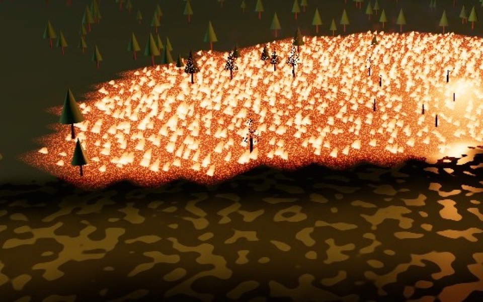 Glowing, scorched ground and leafless trees inside a fire
